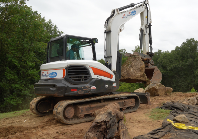Natural-looking ponds depend on intentional rock placement. A large boulder can anchor a shoreline, guide water, frame a waterfall, create a transition between elevations, or establish the visual direction of an entire section.