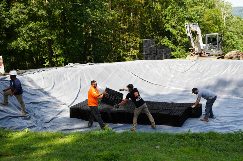 Waterfall construction requires the same combination of technical and artistic judgment. Water needs to travel across the rock in a controlled way while still appearing natural. The builder must anticipate how the feature will look and sound at different flow rates.