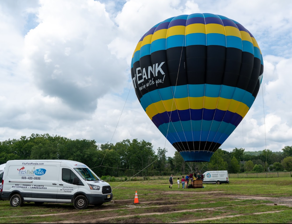 Even a hot-air balloon joined the fifth-anniversary celebration, adding another memorable sight to an already busy Saturday at the farm.
