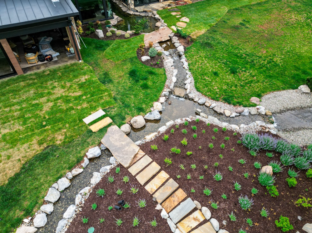 Instead of stopping at the home's exterior, the pond continues through an approximately 32-foot-long channel between adjoining sections of the house.