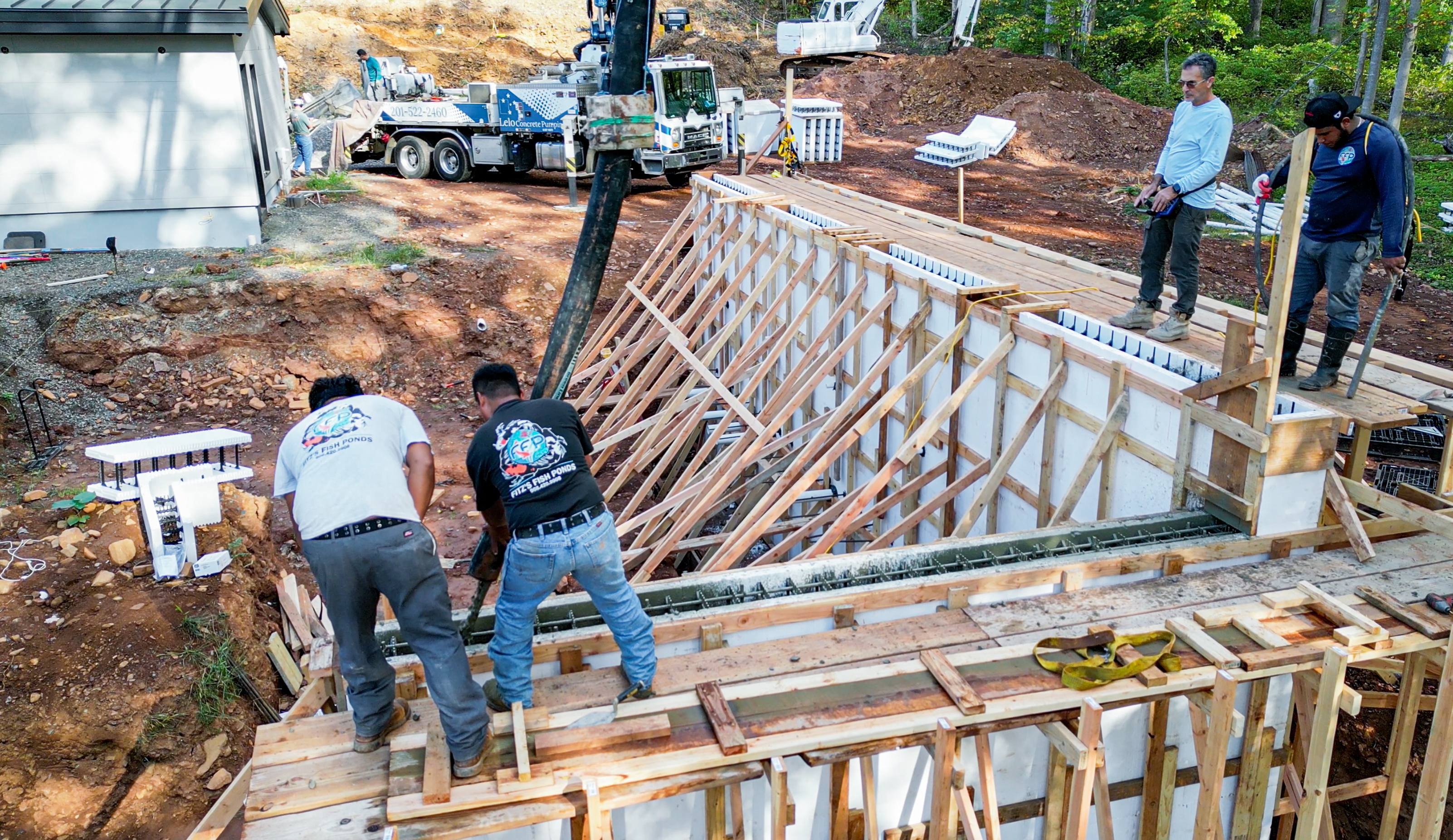 Extensive excavation, reinforced concrete foundations, and carefully positioned steel reinforcement established the structural base for the elevated water features. Extensive excavation, reinforced concrete foundations, and carefully positioned steel reinforcement established the structural base for the elevated water features.